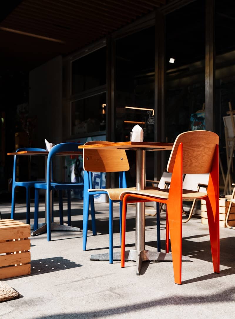 Outdoor cafe seating with colorful chairs and tables