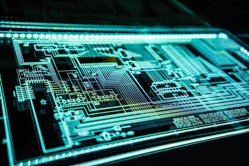 A complex electronic circuit diagram in blue neon lighting