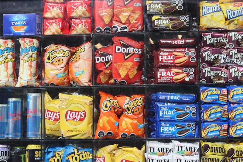 Shelves are filled with various snacks and drinks.
