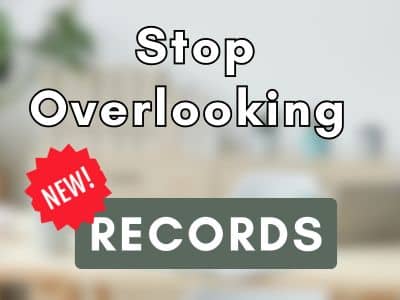 Faded office background with text overlay reading stop overlooking new records. New is in a red circle.