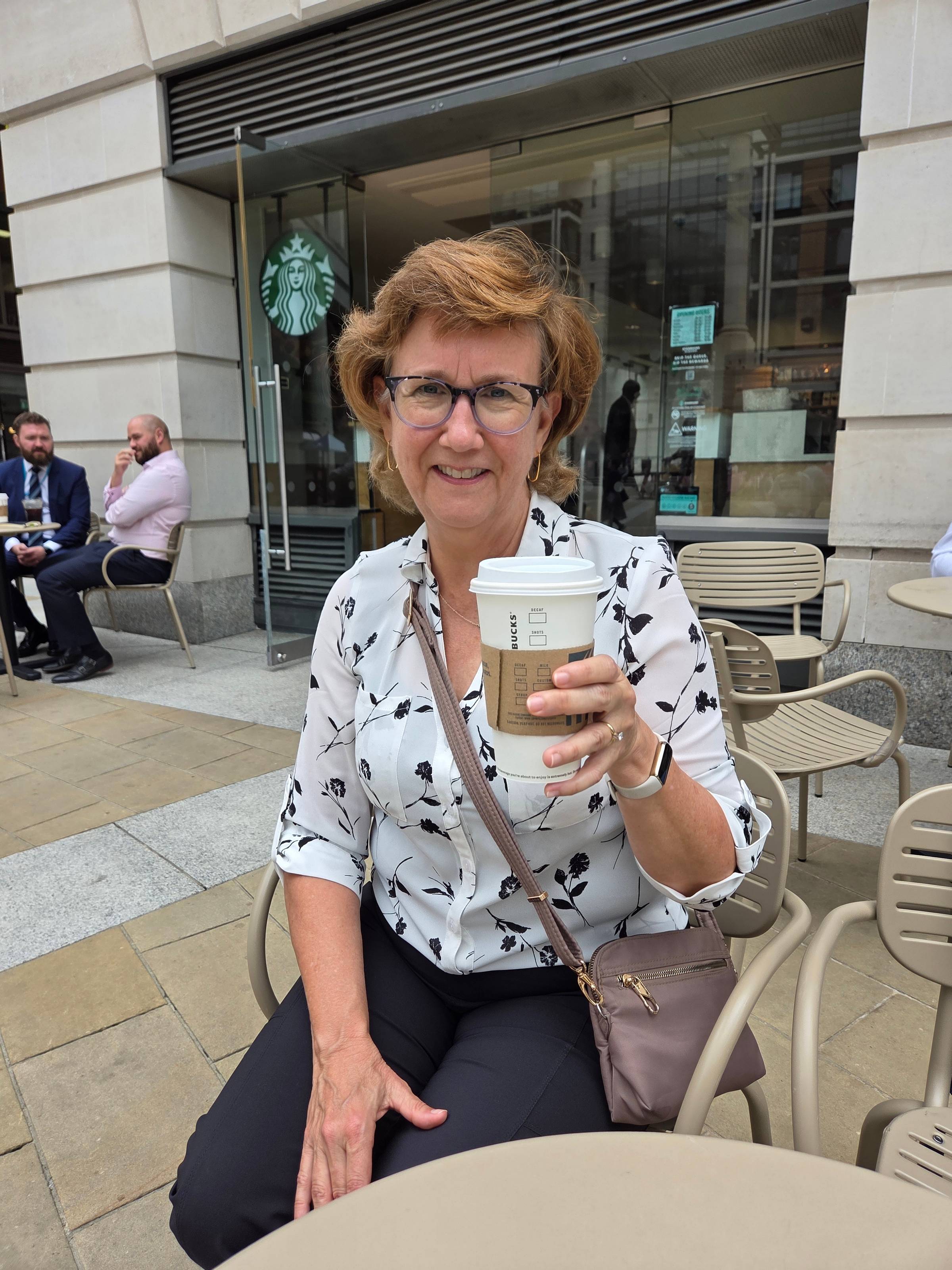 Lisa with a cup of coffee