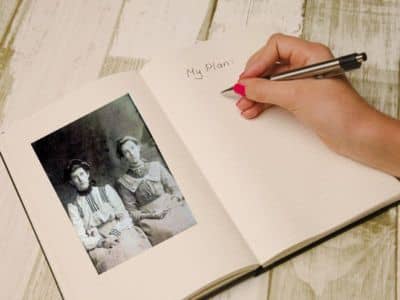 Journal with a hand writing with a pen. Page title is My Plan