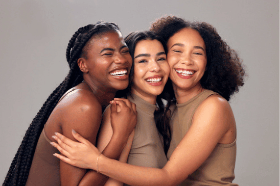 photo of 3 women from different backgrounds and having different hair textures