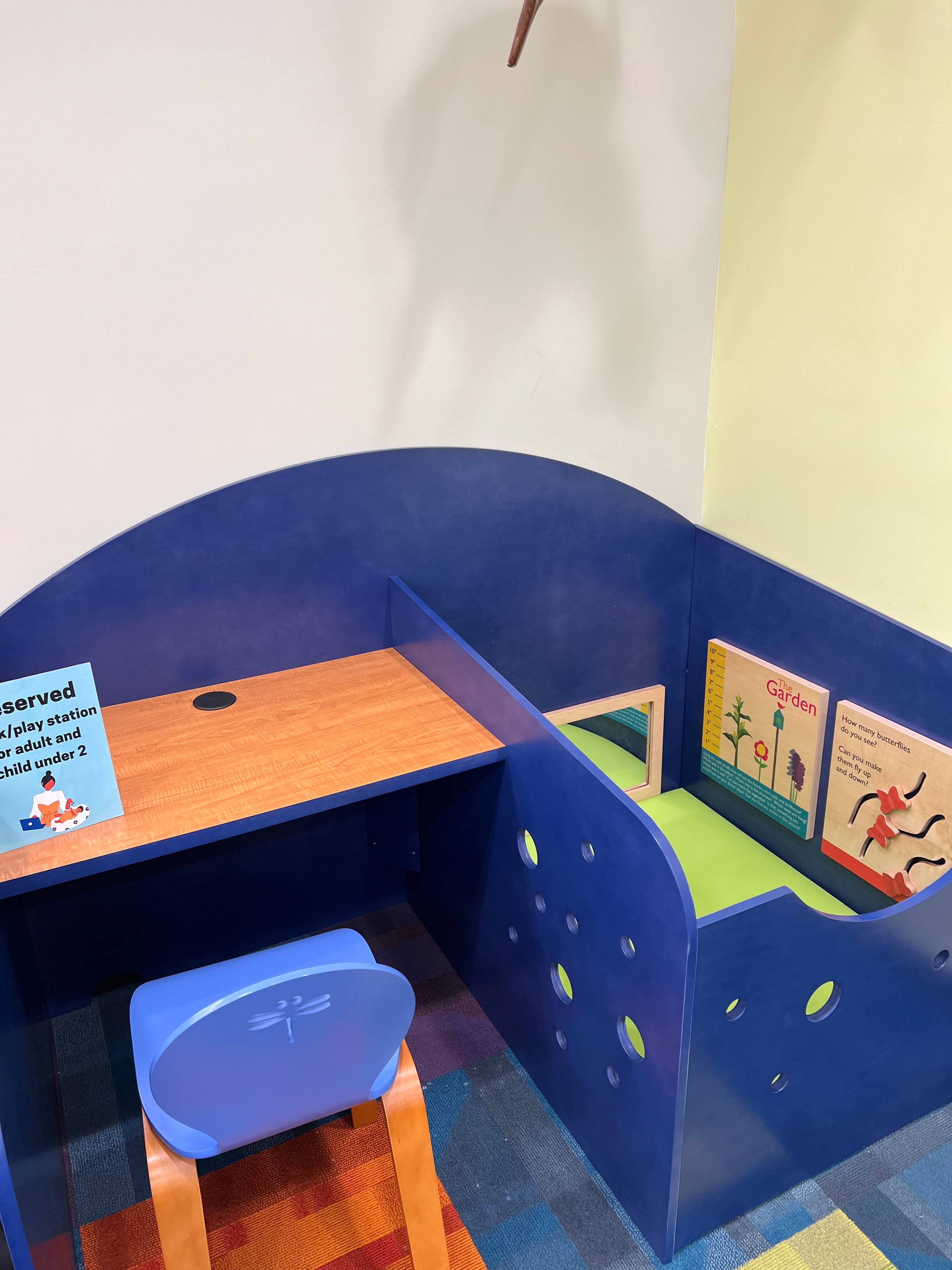 Library reading booth for caregivers with young children.