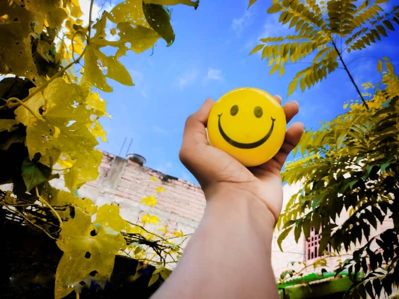 Smiley ball in hand.