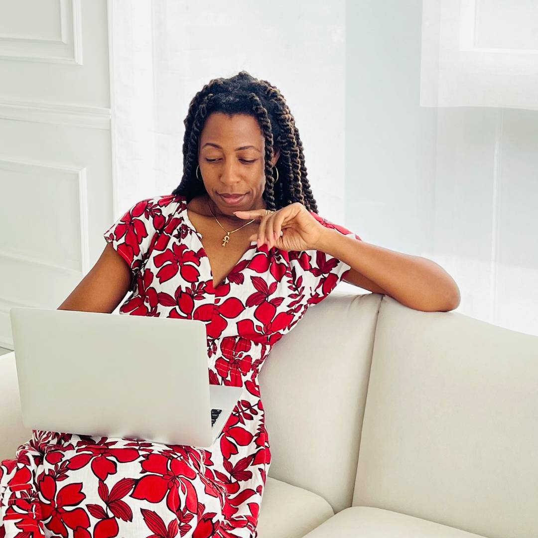 Joyanne Howell on laptop focused and paying attention to details