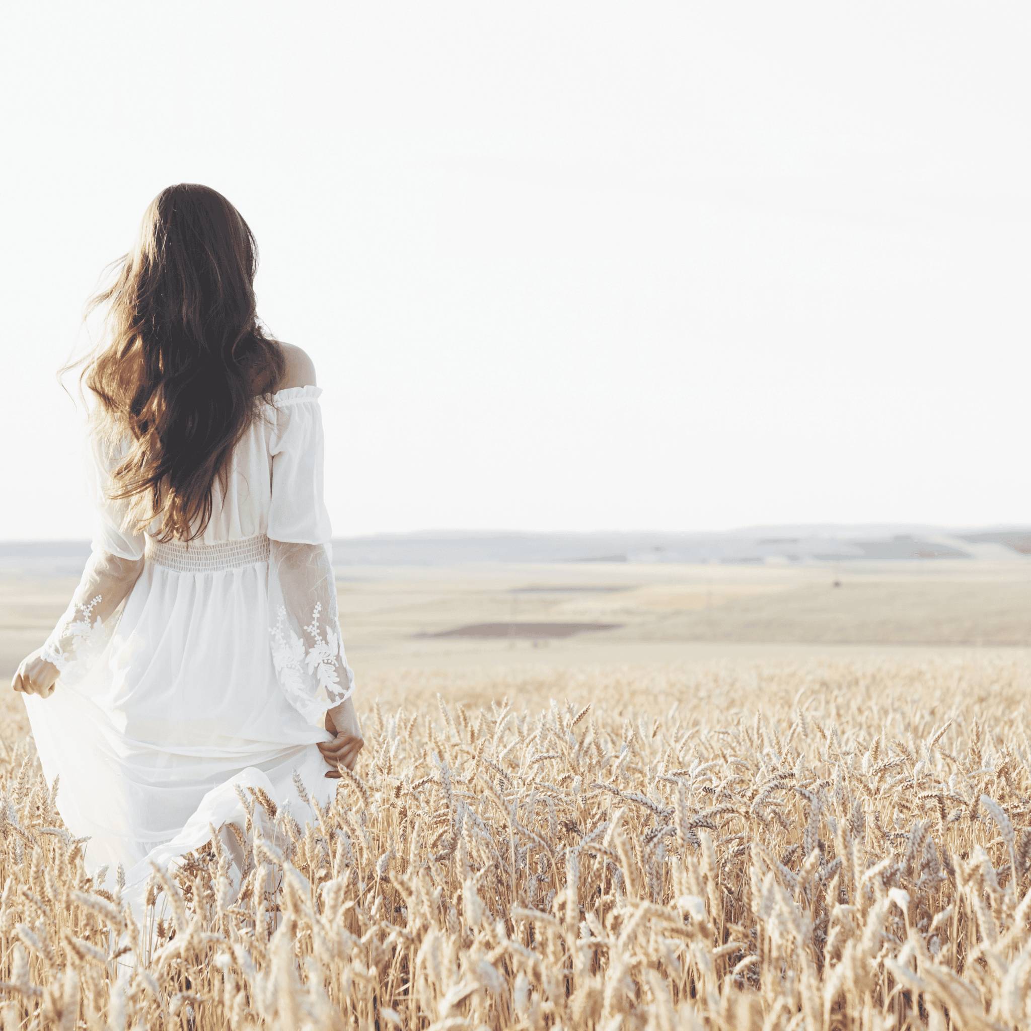 Woman walking in a field.