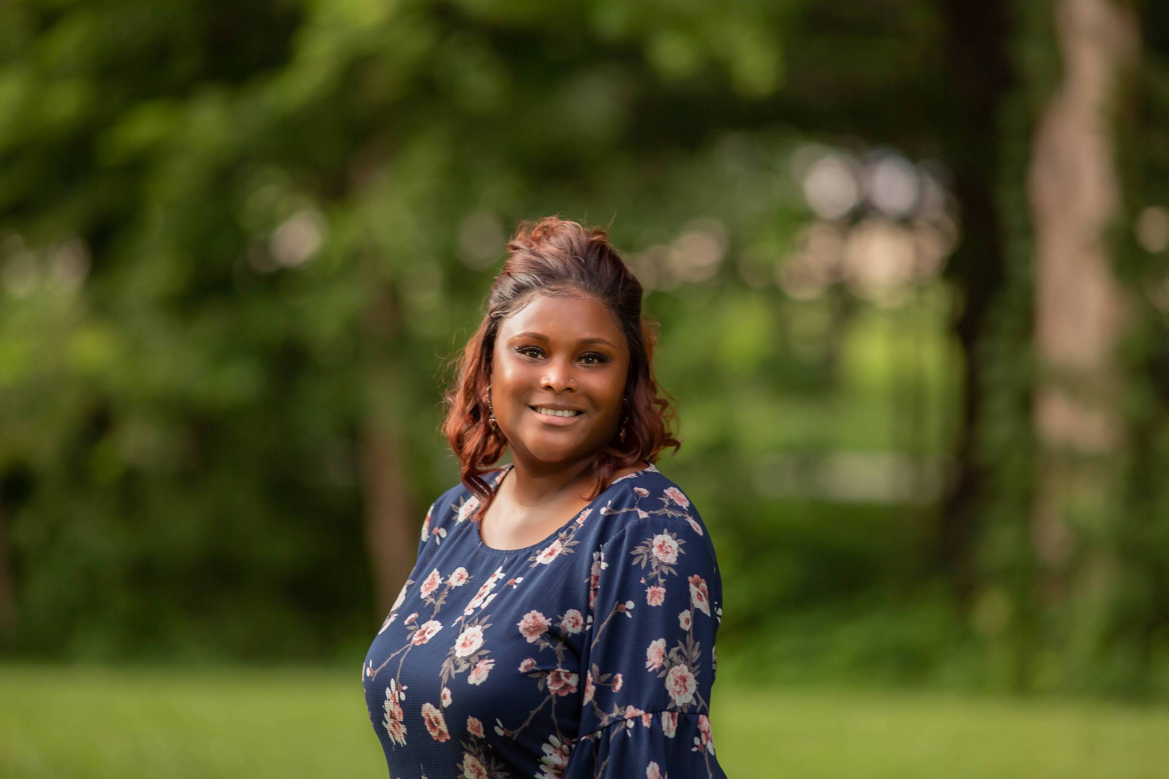 Picture of Tyronica Standing by trees