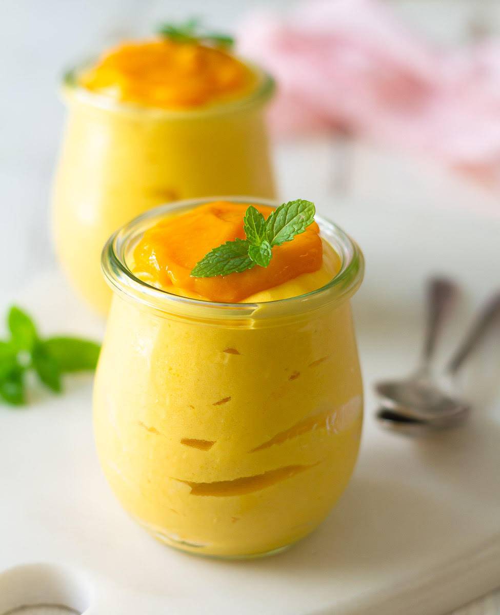 mango mousse in 2 jars.