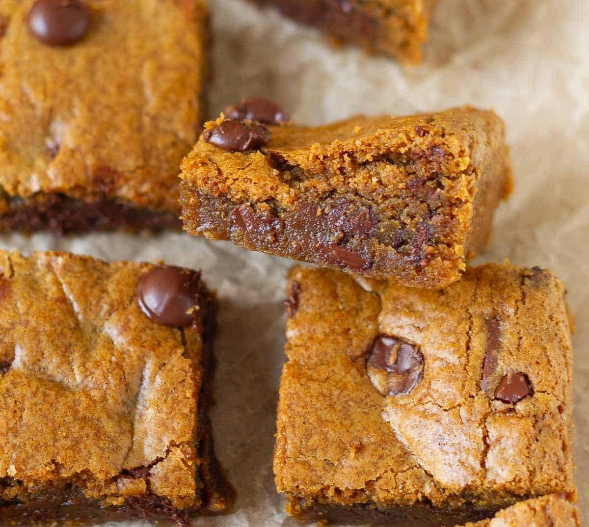 A blondie slice kept sideways with other blondie pieces.