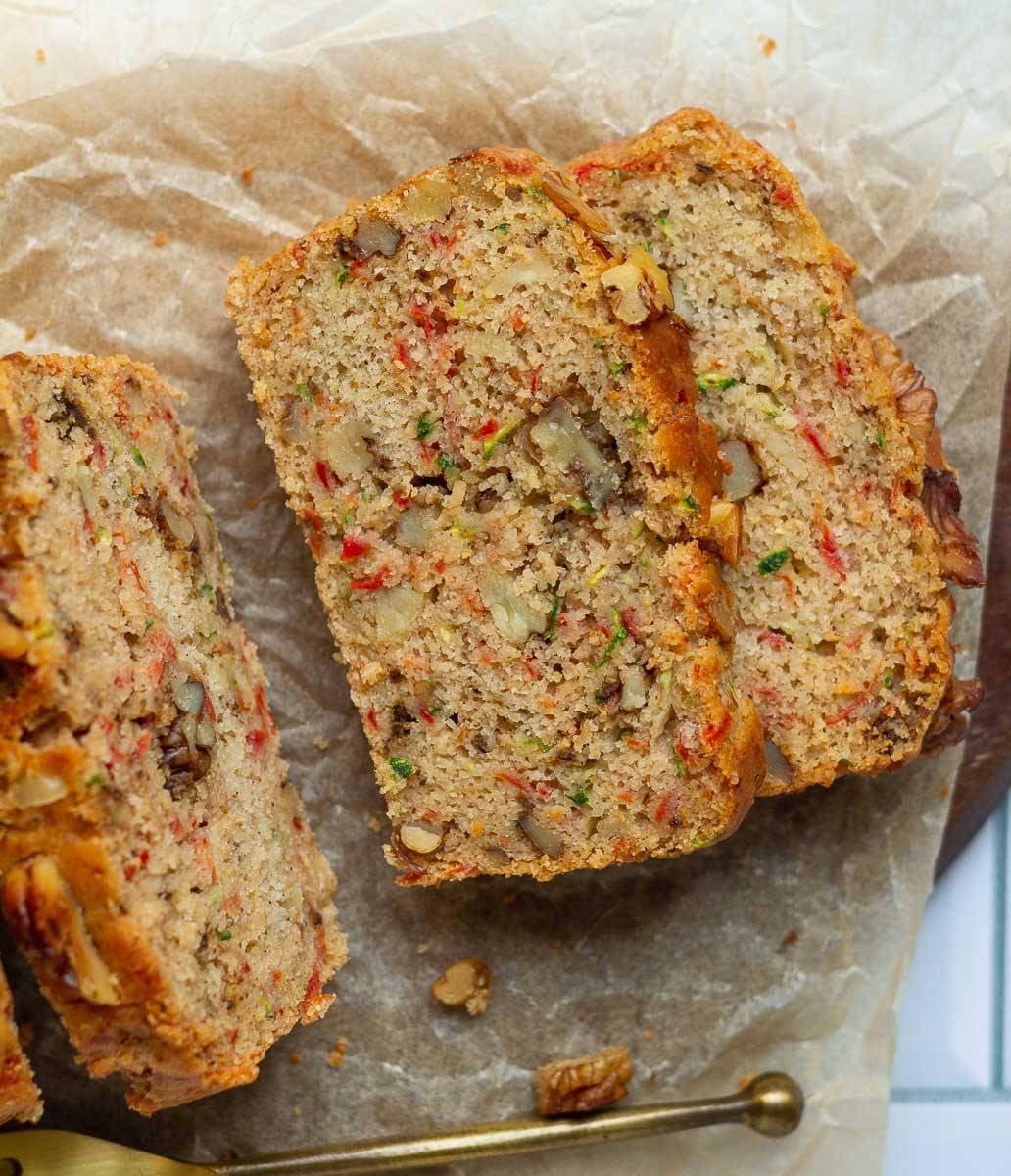 Sliced carrot & zucchini bread on parchment paper.