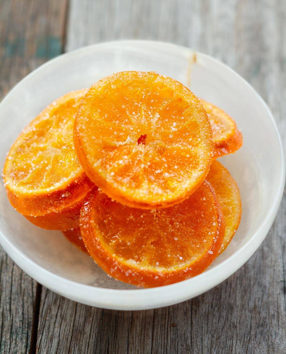 Candied oranges in a bowl.