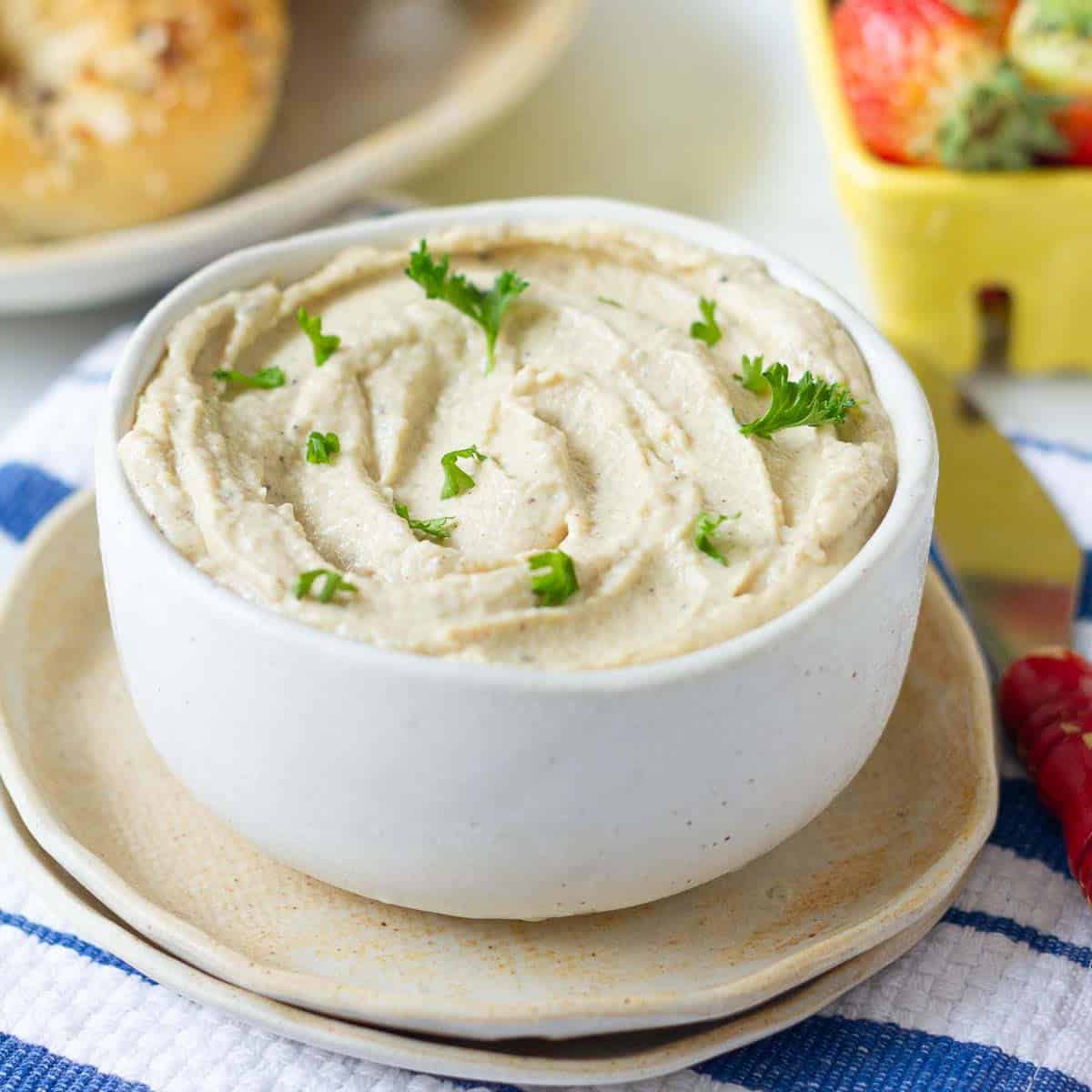 a bowl of ricotta cheese on 2 small plates.