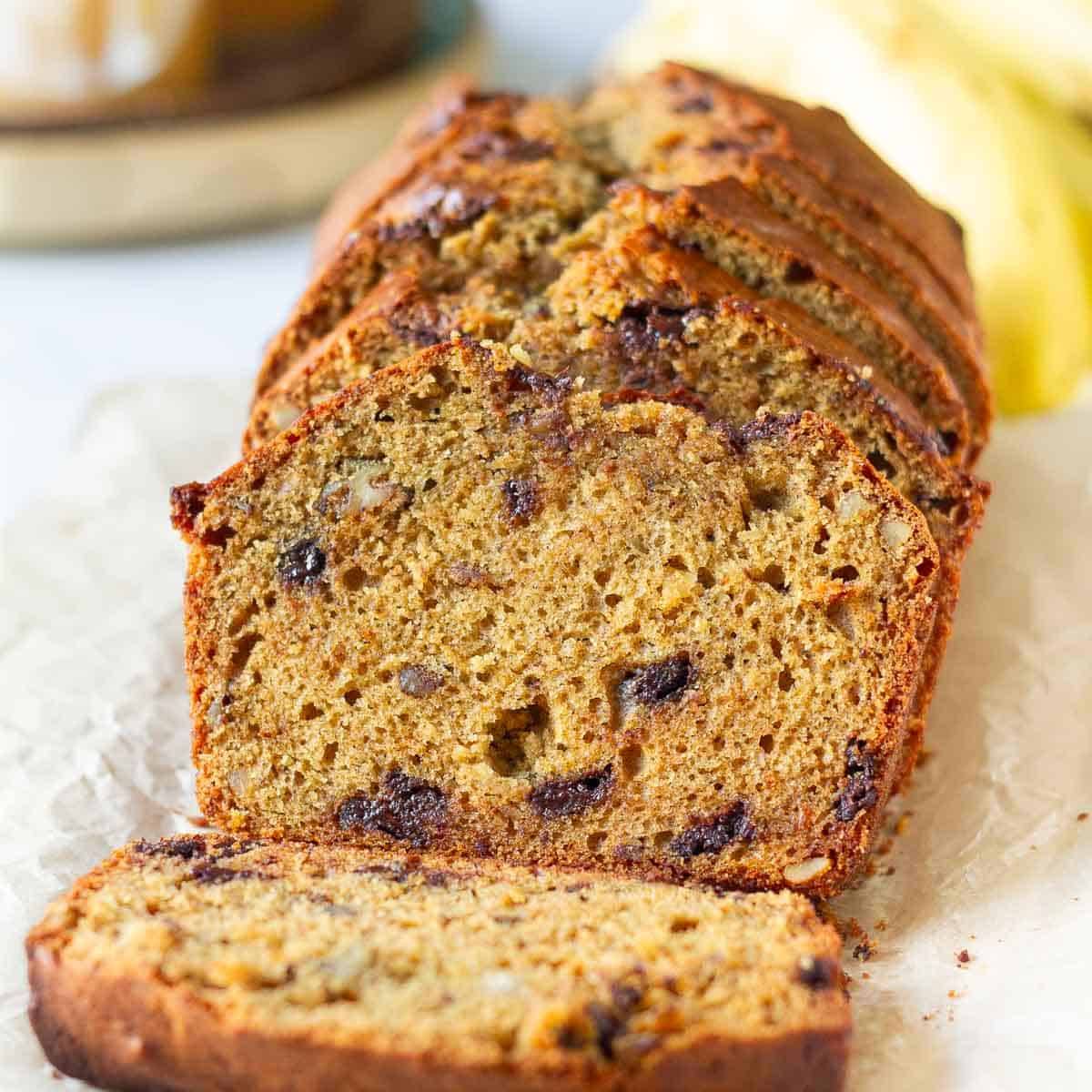 Slices of banana bread on parchment paper.