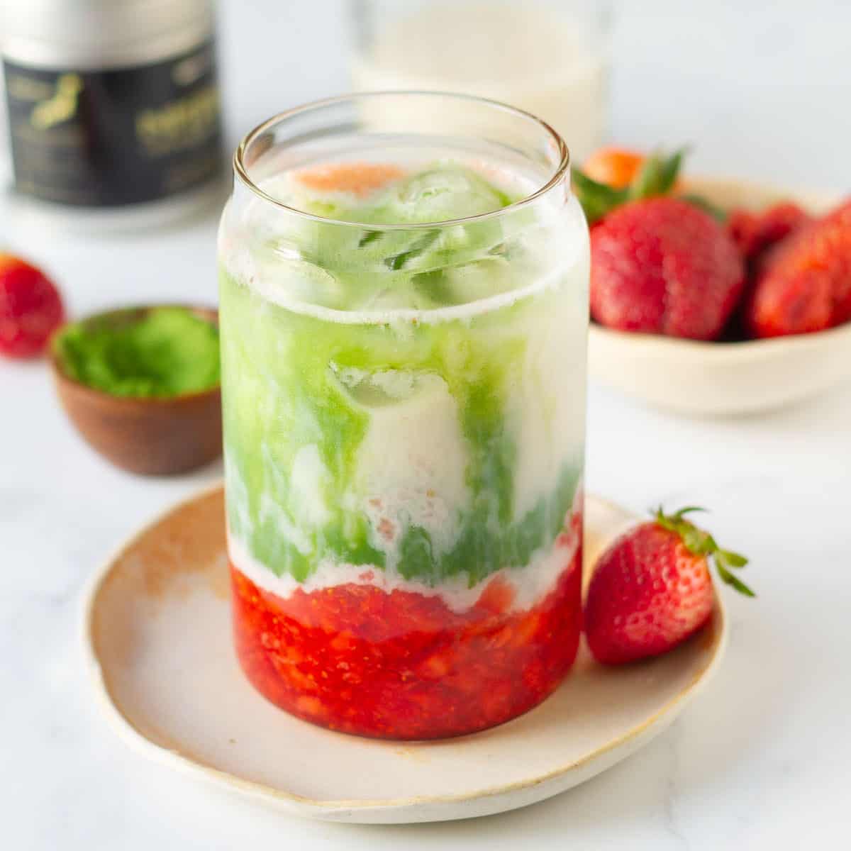 Strawberry matcha latte in a glass.