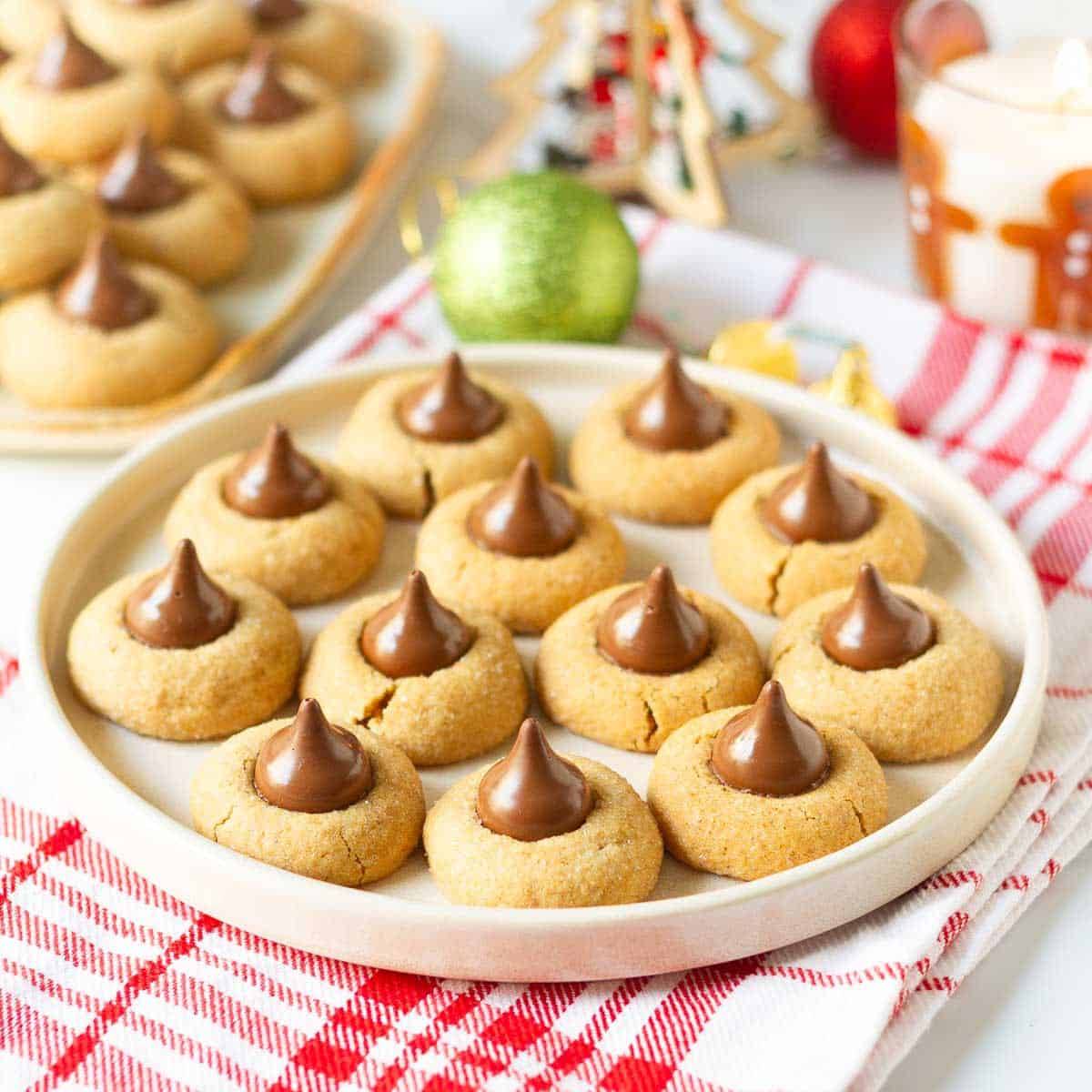 Gingerbread cookies with Hershey's kisses on a serving plate.