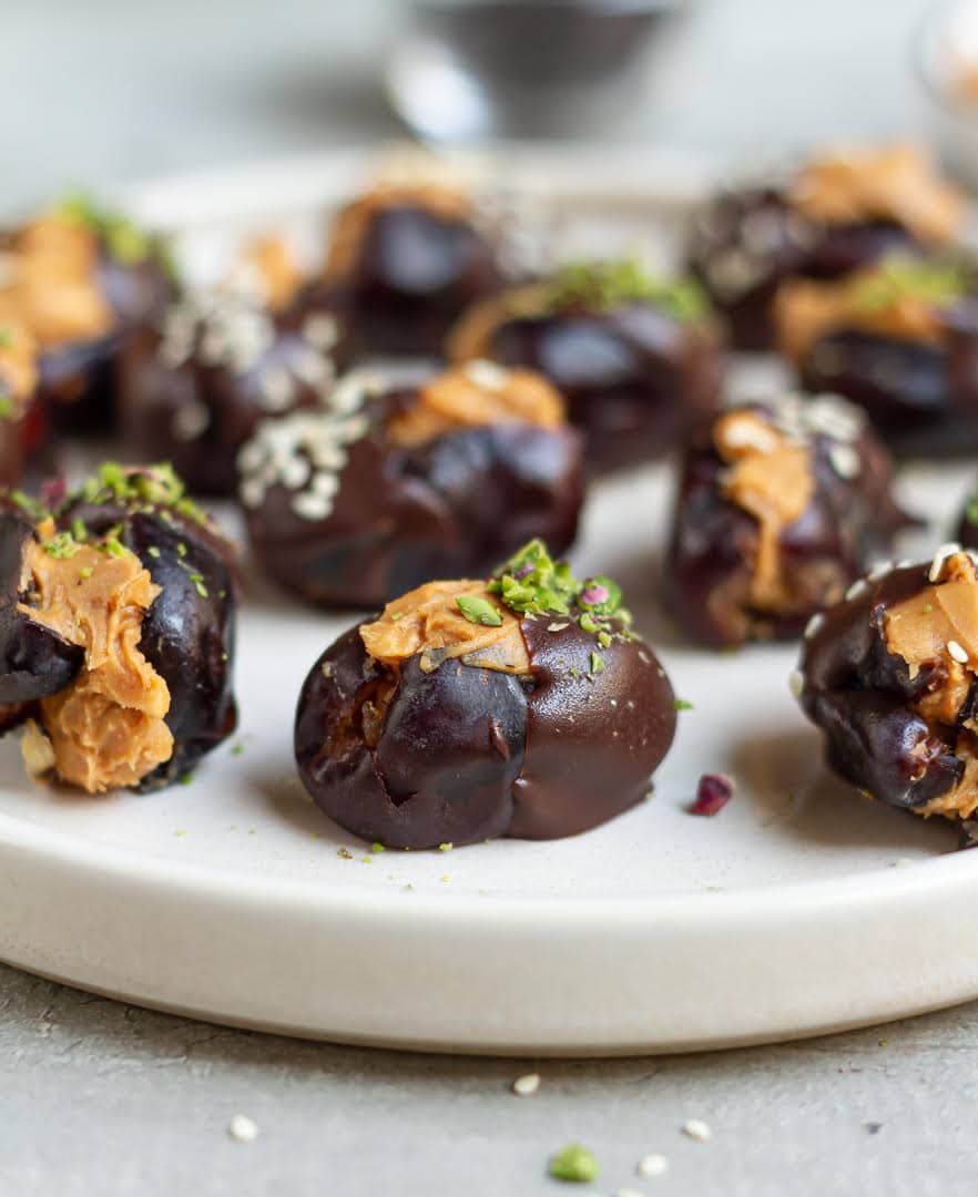 peanut butter stuffed dates on a plate.