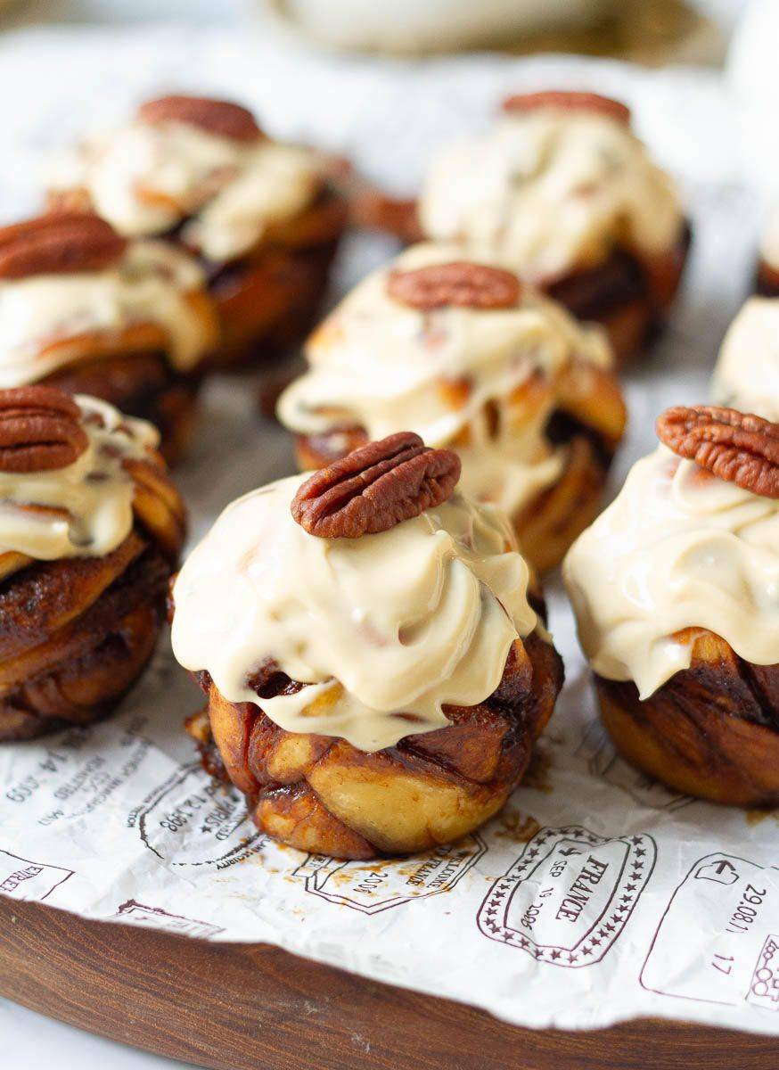 Coffee cinnamon rolls with cream cheese frosting and pecans.