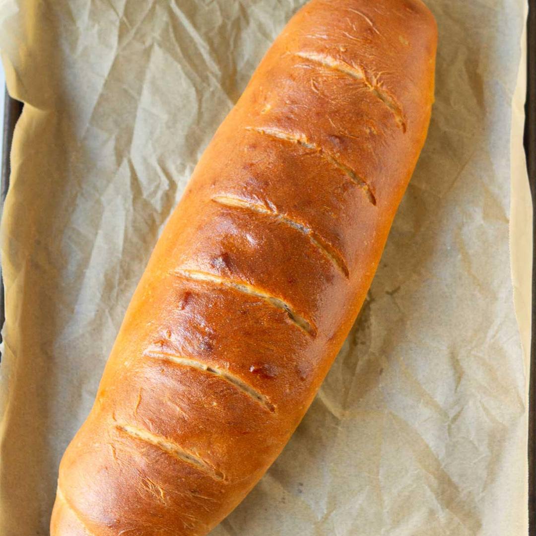 A loaf of bread on parchment paper.