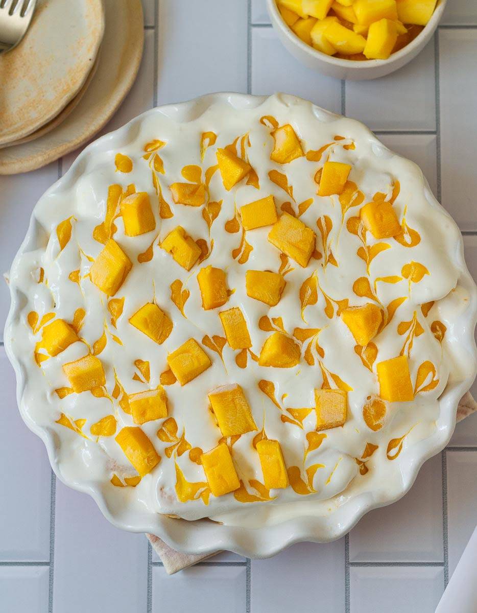 Mango and cream in a dish.