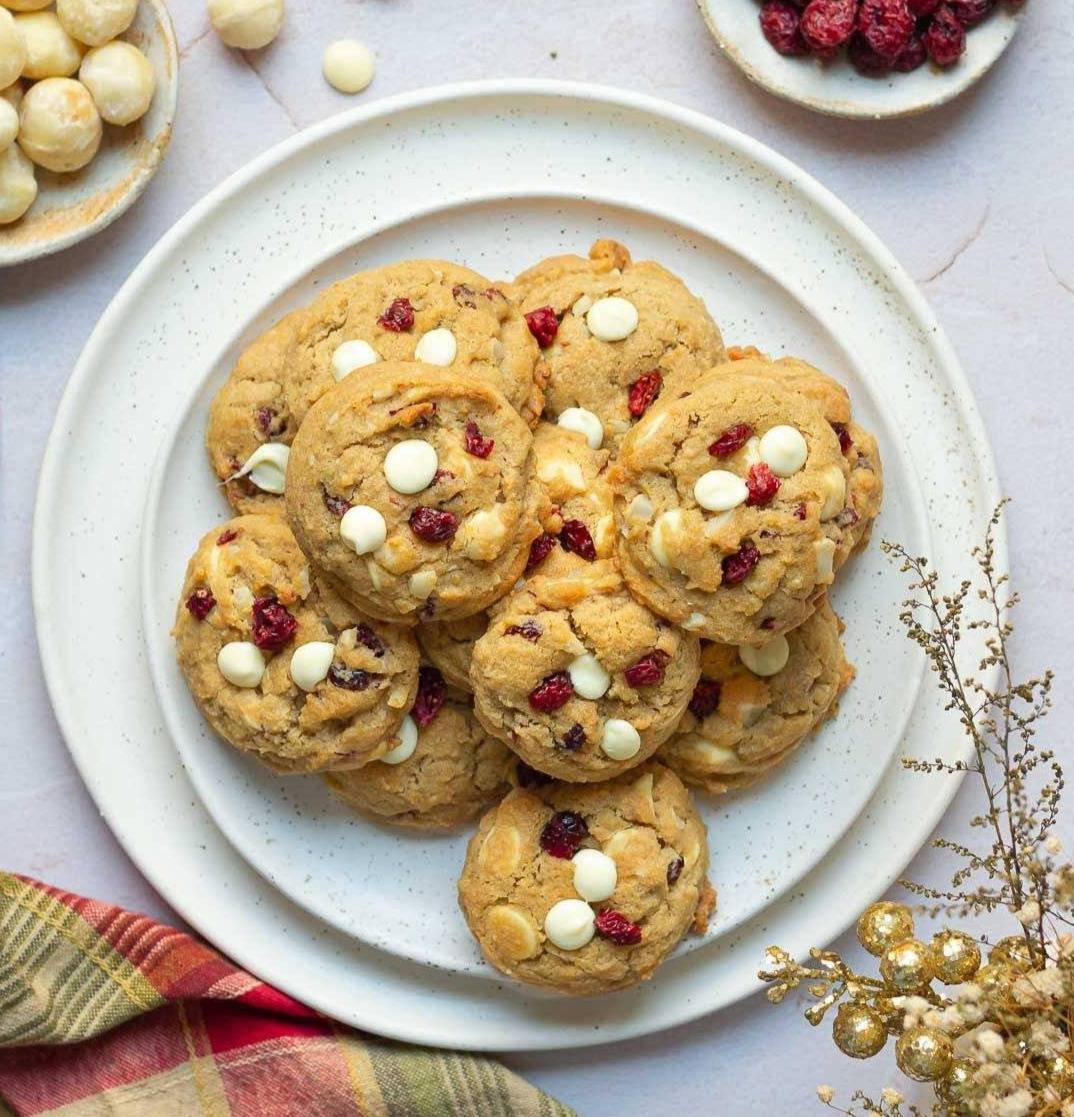 Cookies with white chocolate and cranberries on a plate.