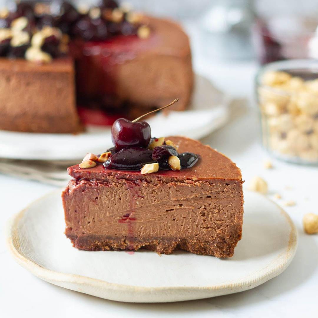 A slice of chocolate cheesecake on a small plate.