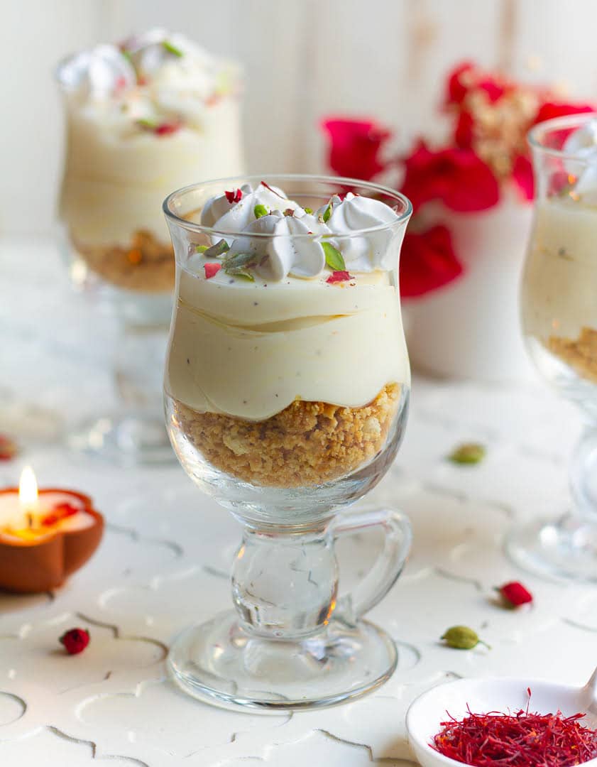 3 dessert glasses with saffron cheesecake.