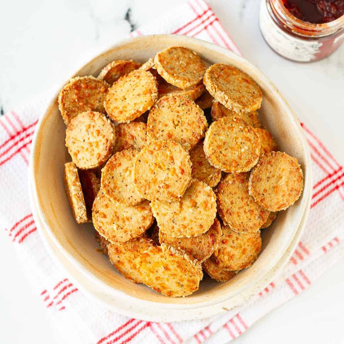 Cheese crackers with carom seeds in a bowl.