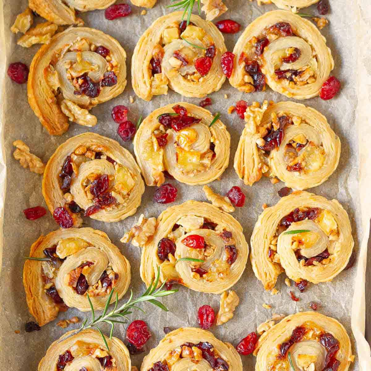 Pinwheels with brie and cranberries on a tray.