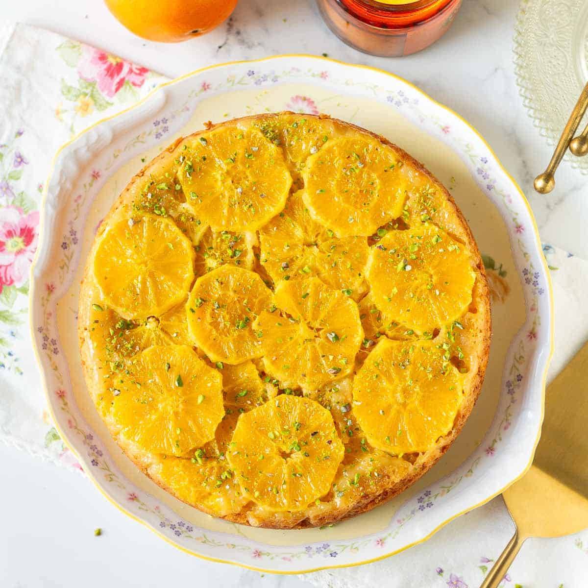 Orange upside down cake on a platter.