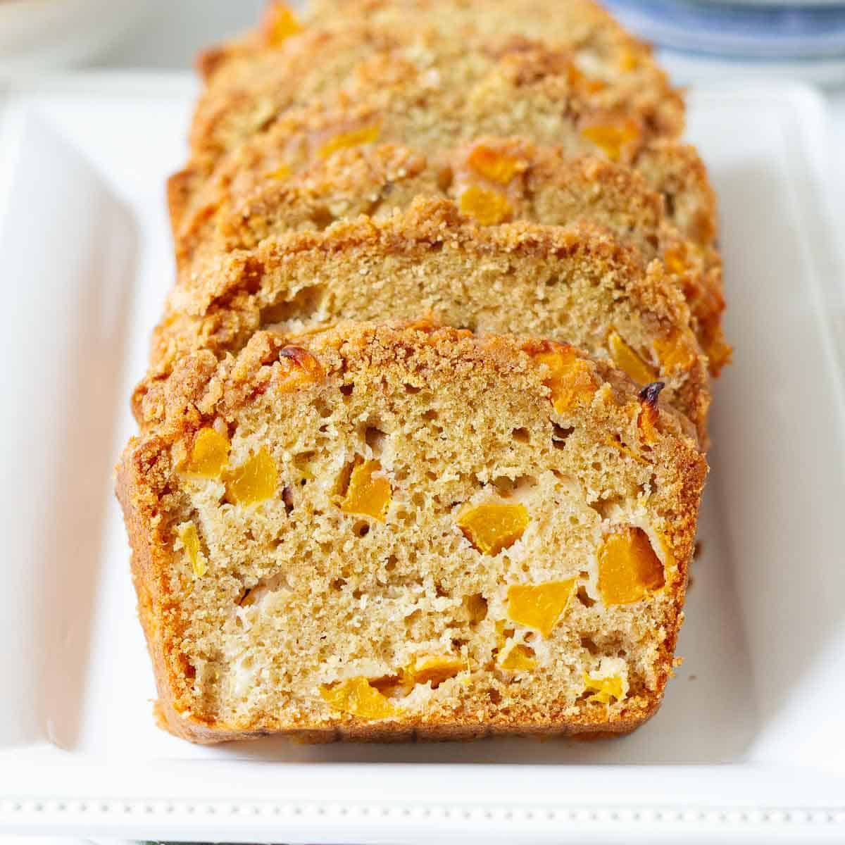 Sliced peach bread on a platter.
