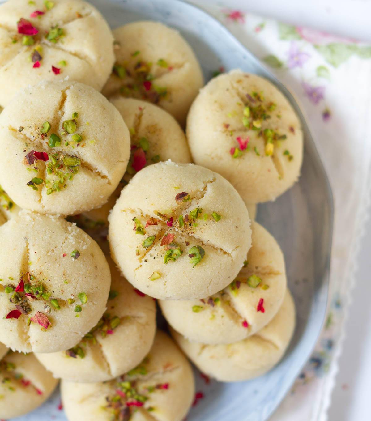 A stack of cookies on a plate.