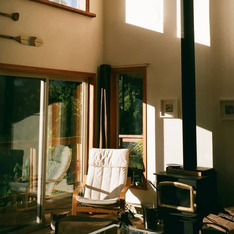 a living room with a chair and television