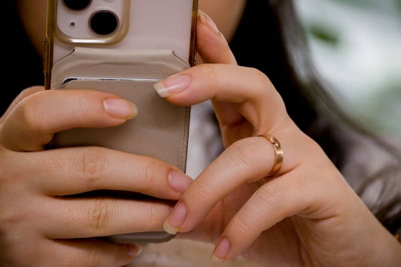 Woman's hands holding a smartphone