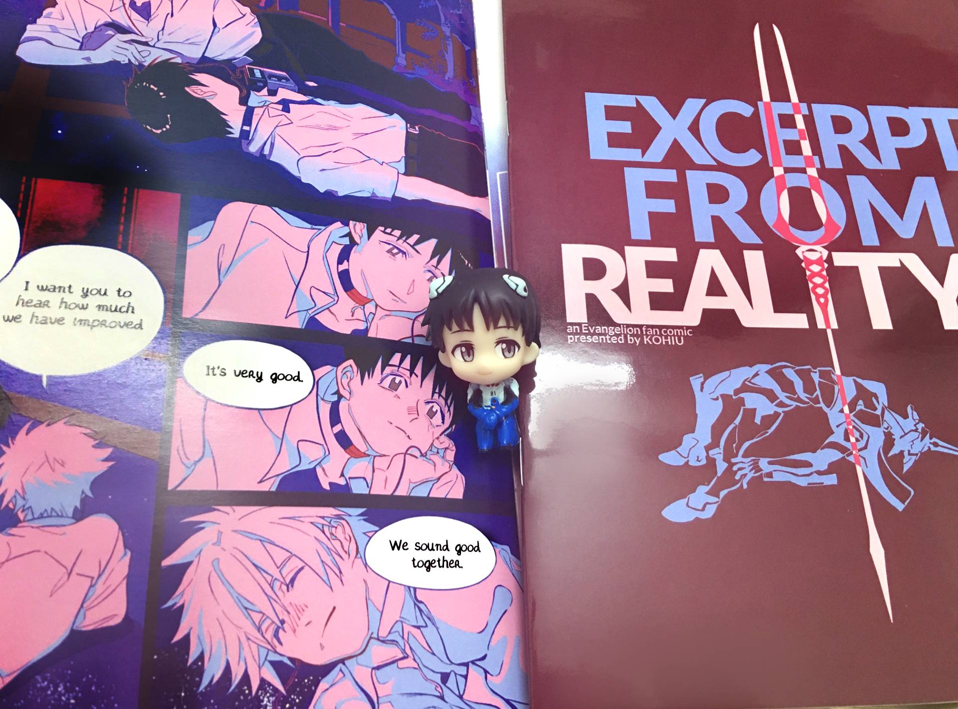 Printed comic with Shinji gachapon sitting in the middle.