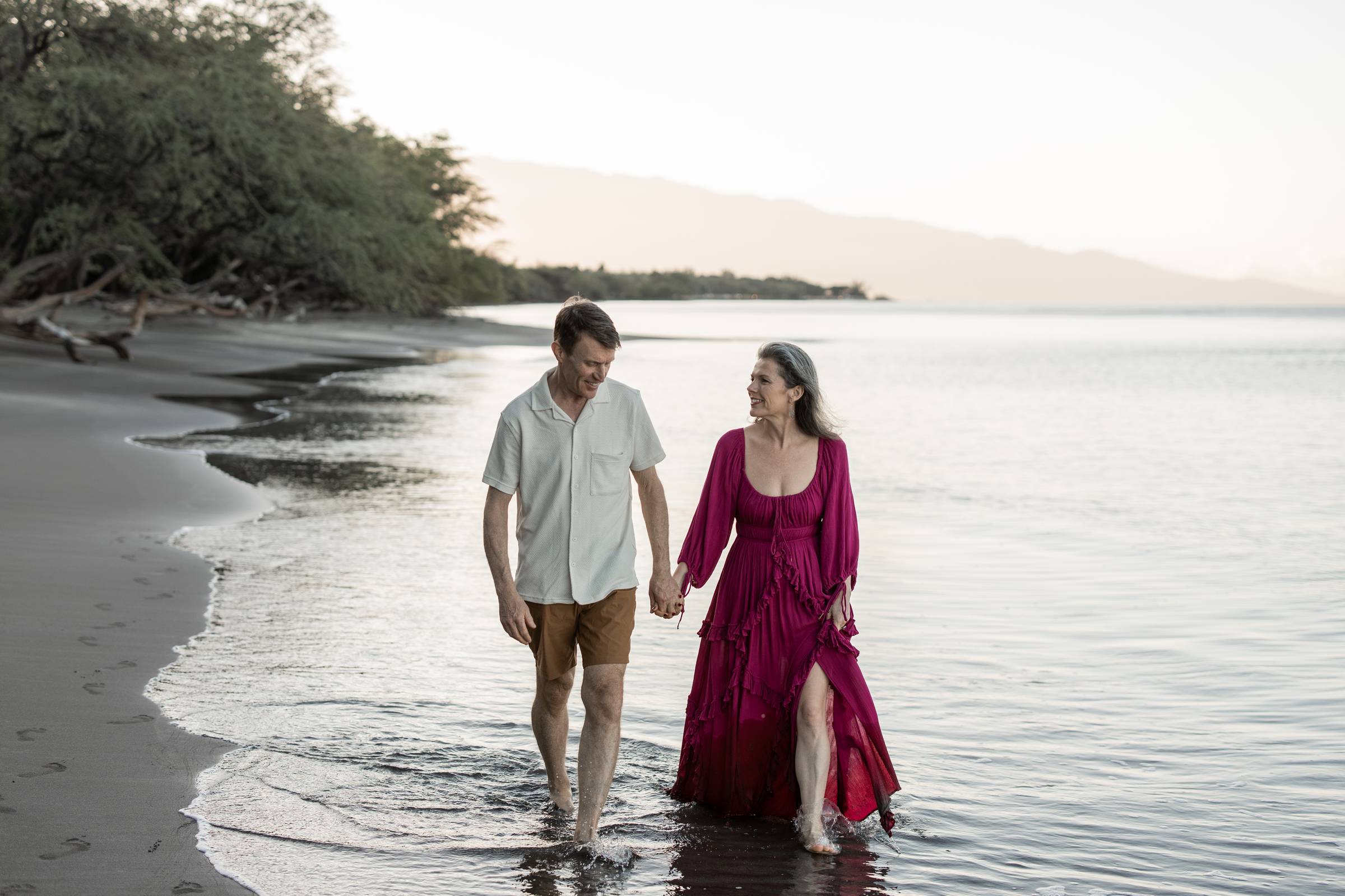 Michele Lisenbury Christensen, creator of RECEIVE love & sex mentorship for powerful women, walks with her husband Kurt on the beach