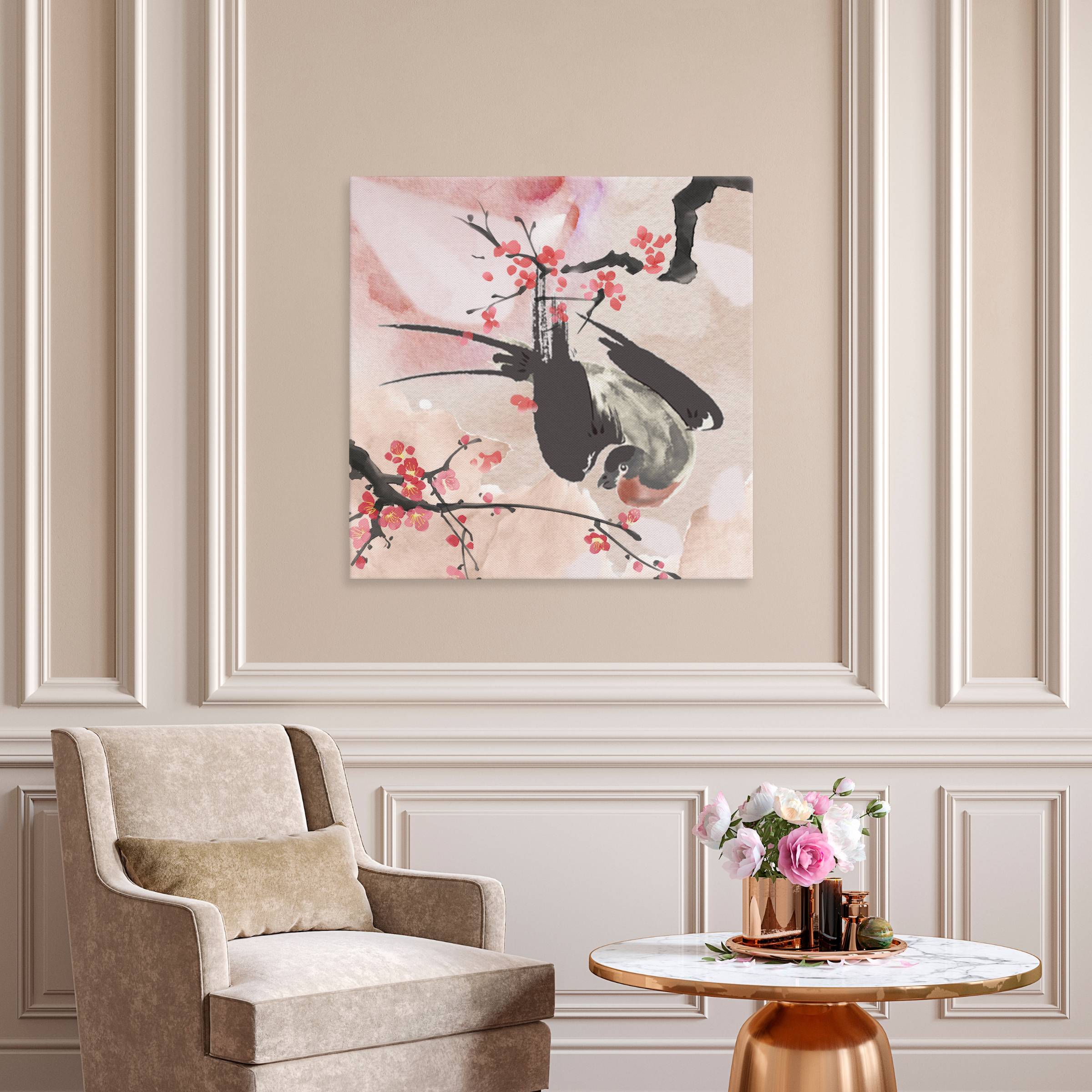 An aerial view of a bird sitting beneath cherry blossom branches.