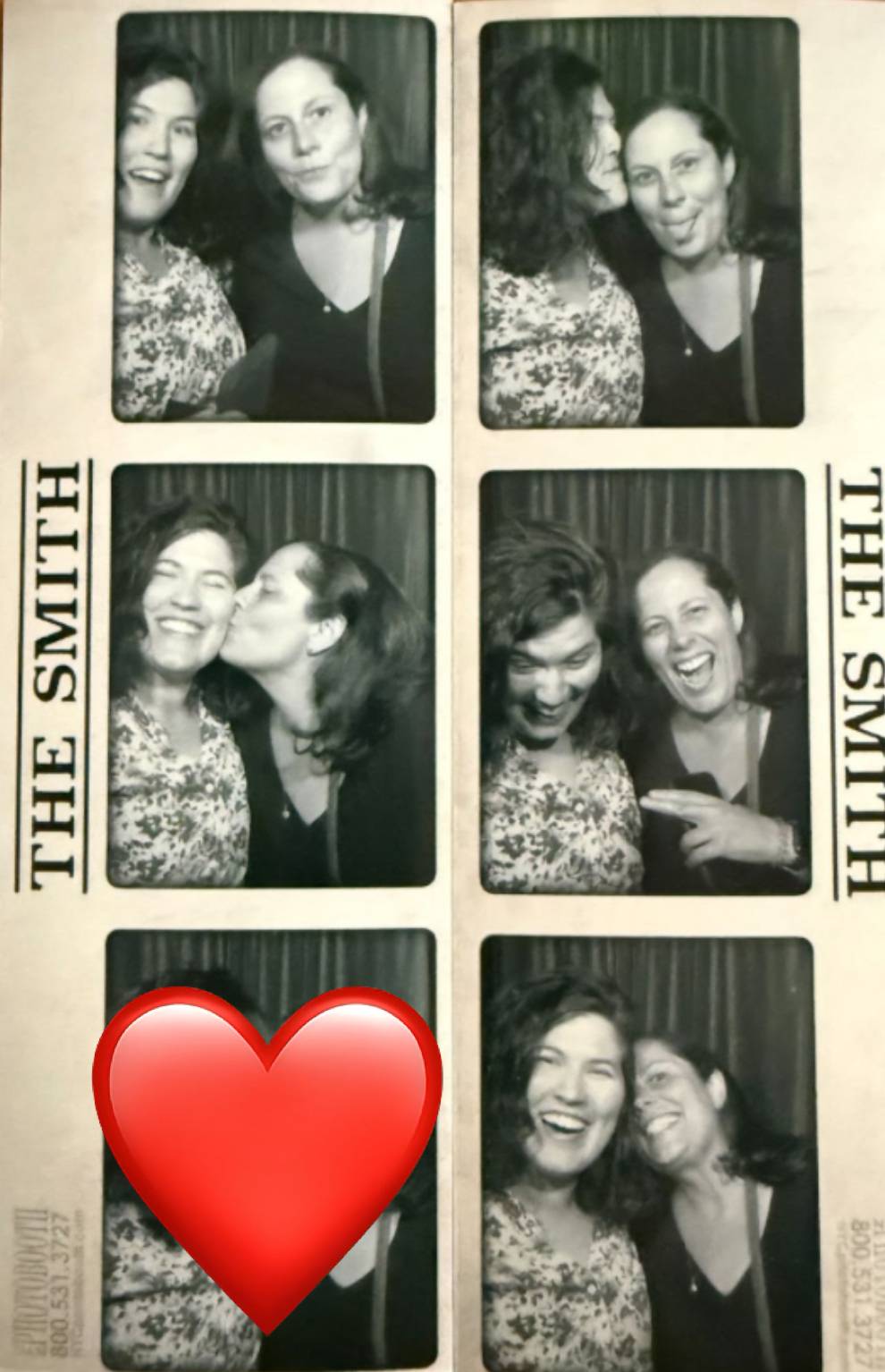 Black-and-white photo booth strip of a couple sharing playful moments. They smile, lean in close, exchange a kiss on the cheek, laugh together, and enjoy being affectionate. A red heart emoji covers part of the final frame.