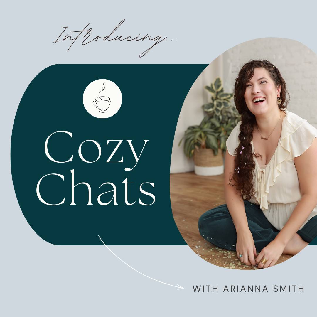 Graphic introducing 'Cozy Chats' with Arianna Smith. The design features a light blue background with a dark green semi-circle on the left side. On the left, a white coffee cup icon is shown above the text 'Cozy Chats' in an elegant serif font. On the right, a smiling woman with long, wavy hair sits casually on the floor, wearing a cream blouse and green pants, with plants and a white wall in the background. An arrow points from the text to the woman, labeled 'With Arianna Smith.'