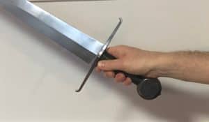 Sword extended in the grip
