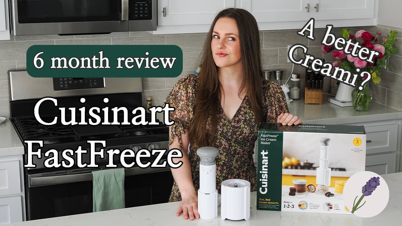 A woman in a kitchen with a box for an ice cream maker