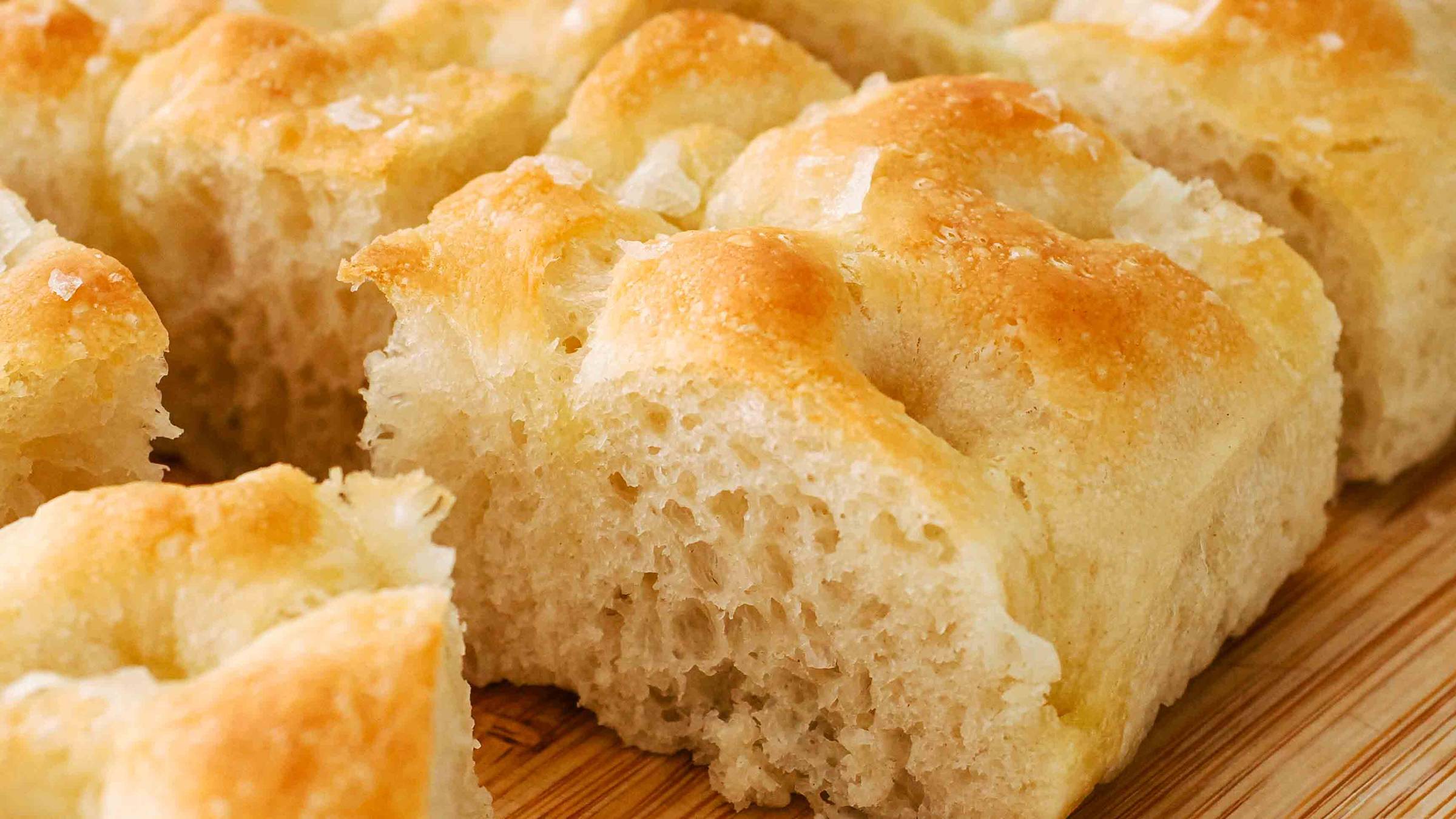 A closeup of a slice of focaccia bread.