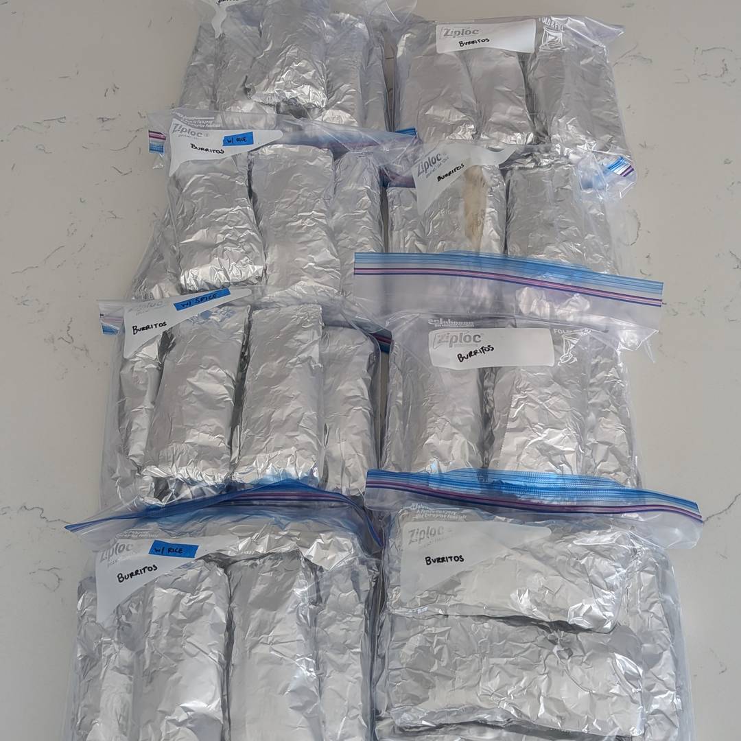 Zipper bags filled with foil-wrapped burritos