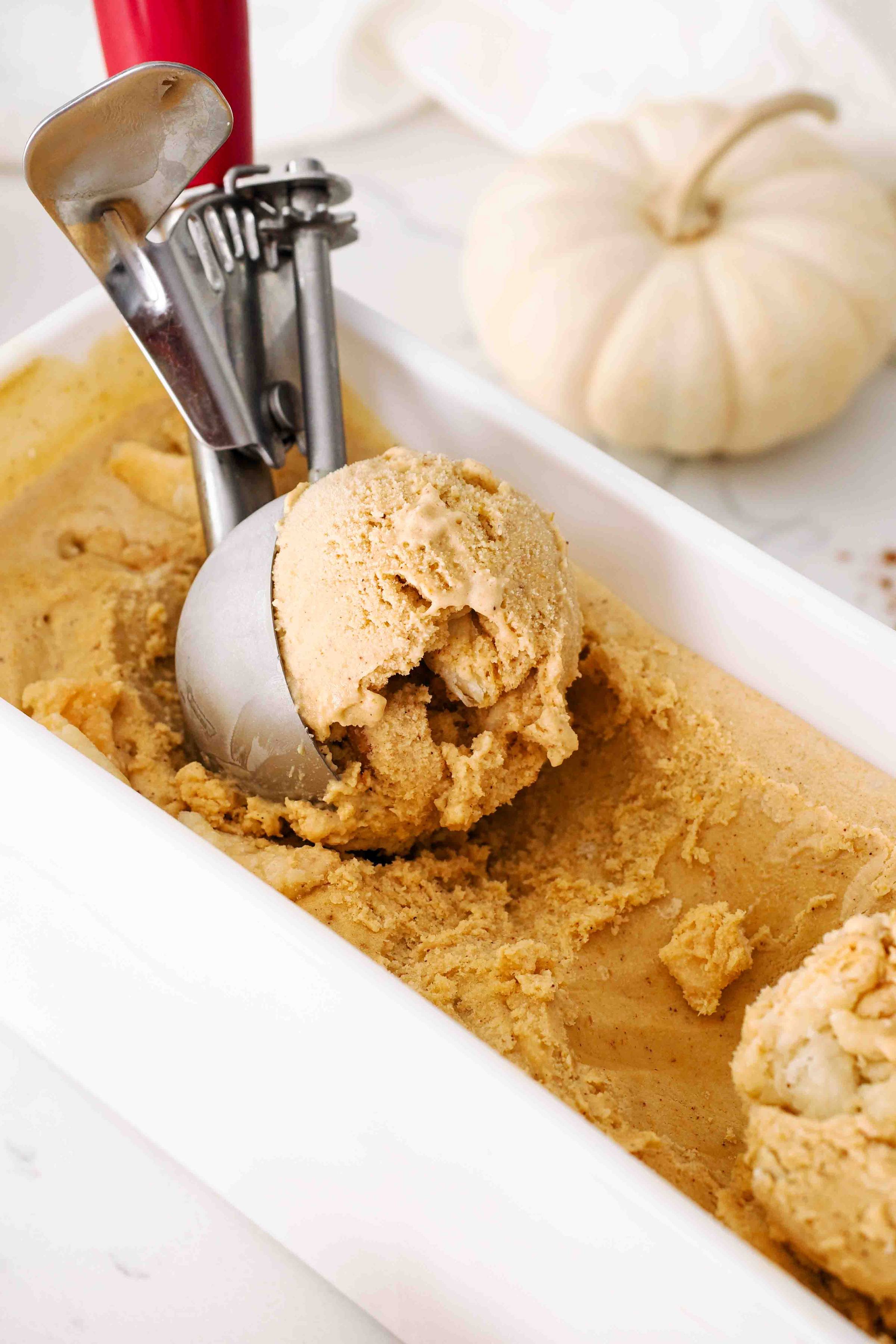 A scoop of pumpkin ice cream