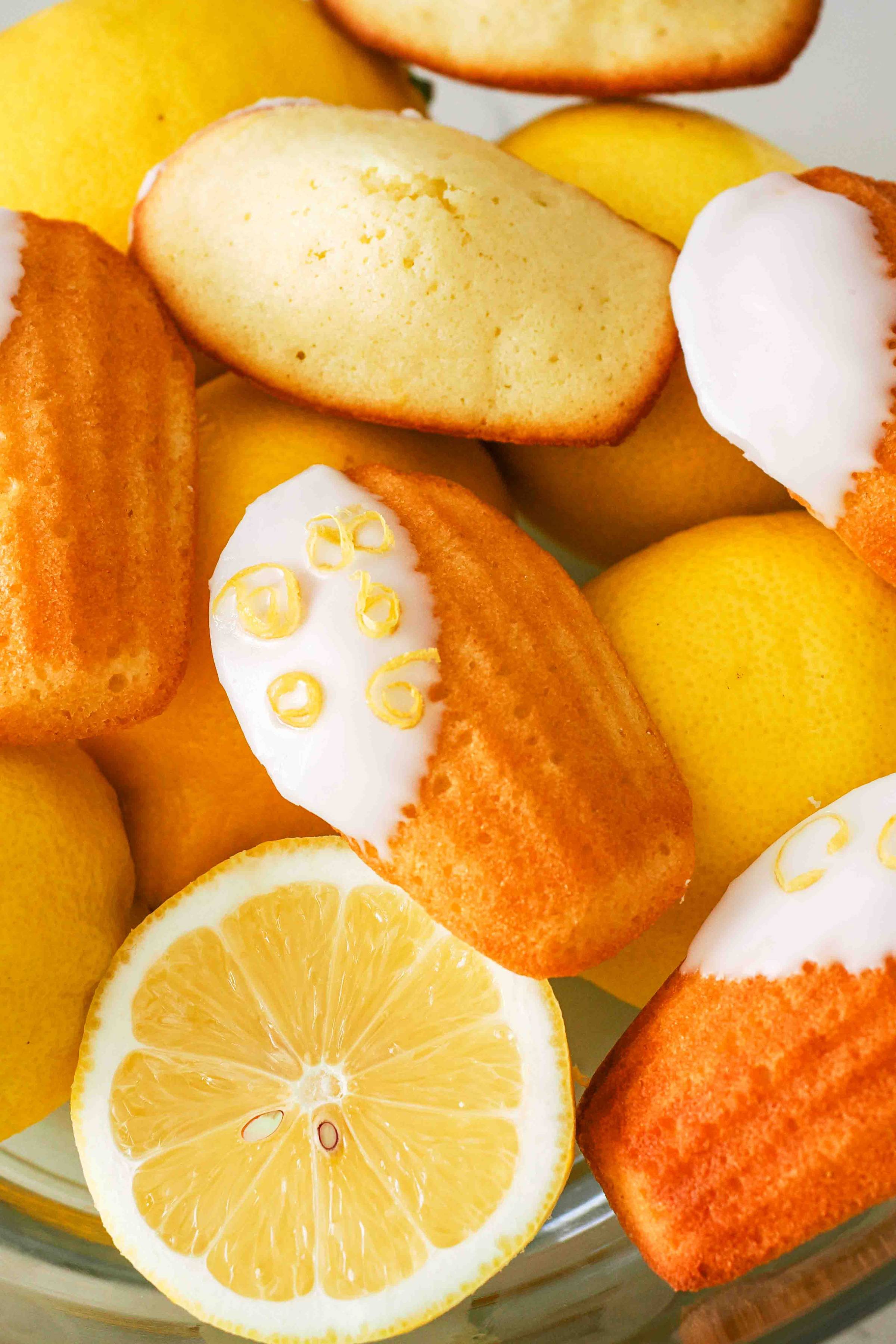 Lemon madeleines near cut lemons