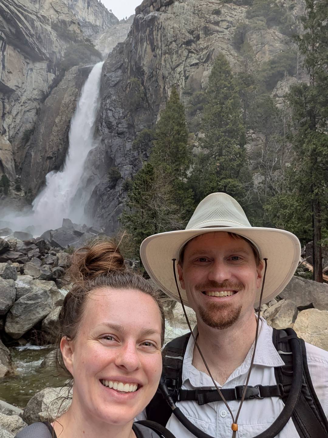 Austin and Alyssa in front of a waterfall