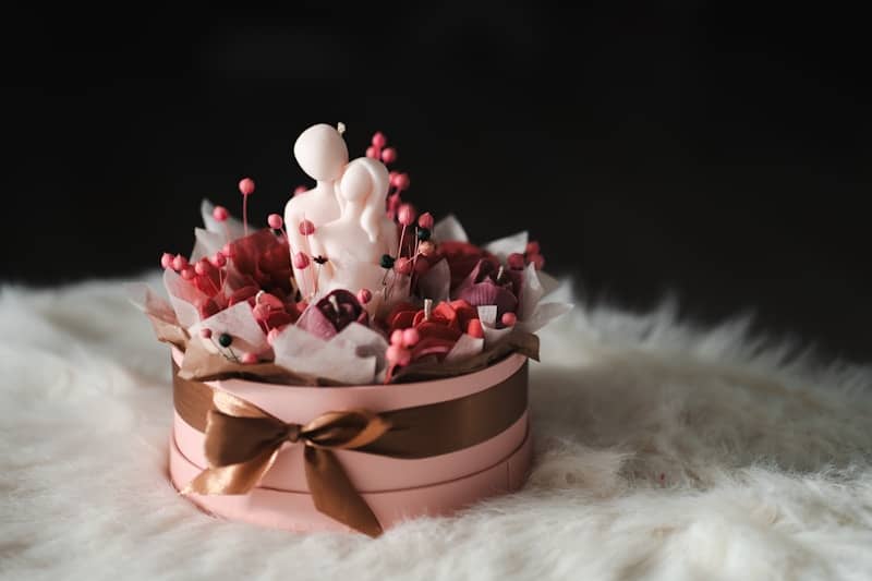 A pink hat with a bow on top of it