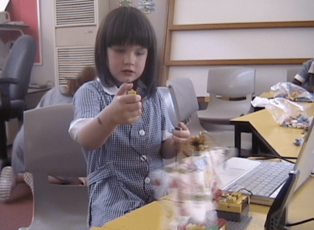 girl making a robot ballerina