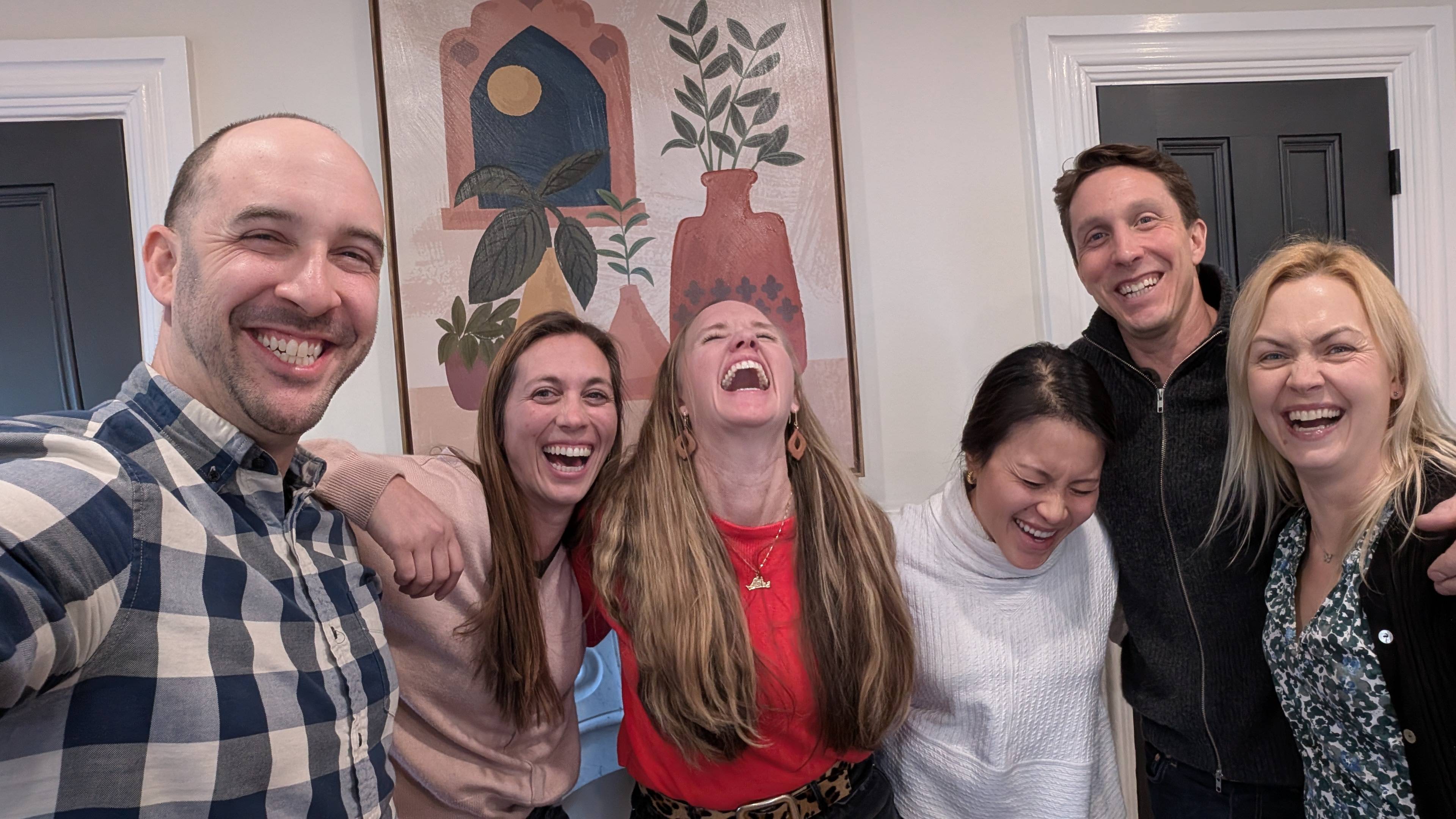 Dan Newman, Krysta Van Ranst, and her team at BuildingPPL, laughing