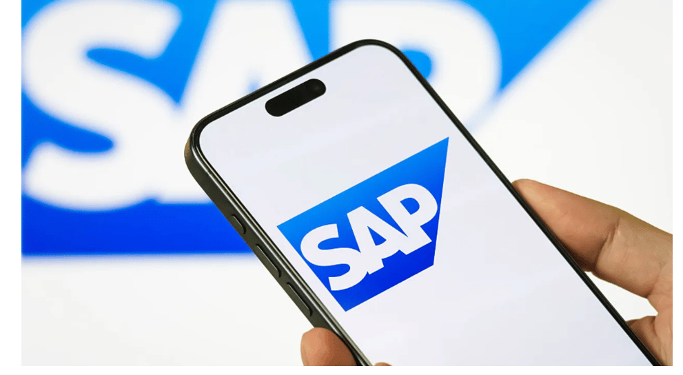 Smartphone showing SAP logo with blurred SAP background, representing SAP enterprise software, ERP solutions, and business management systems